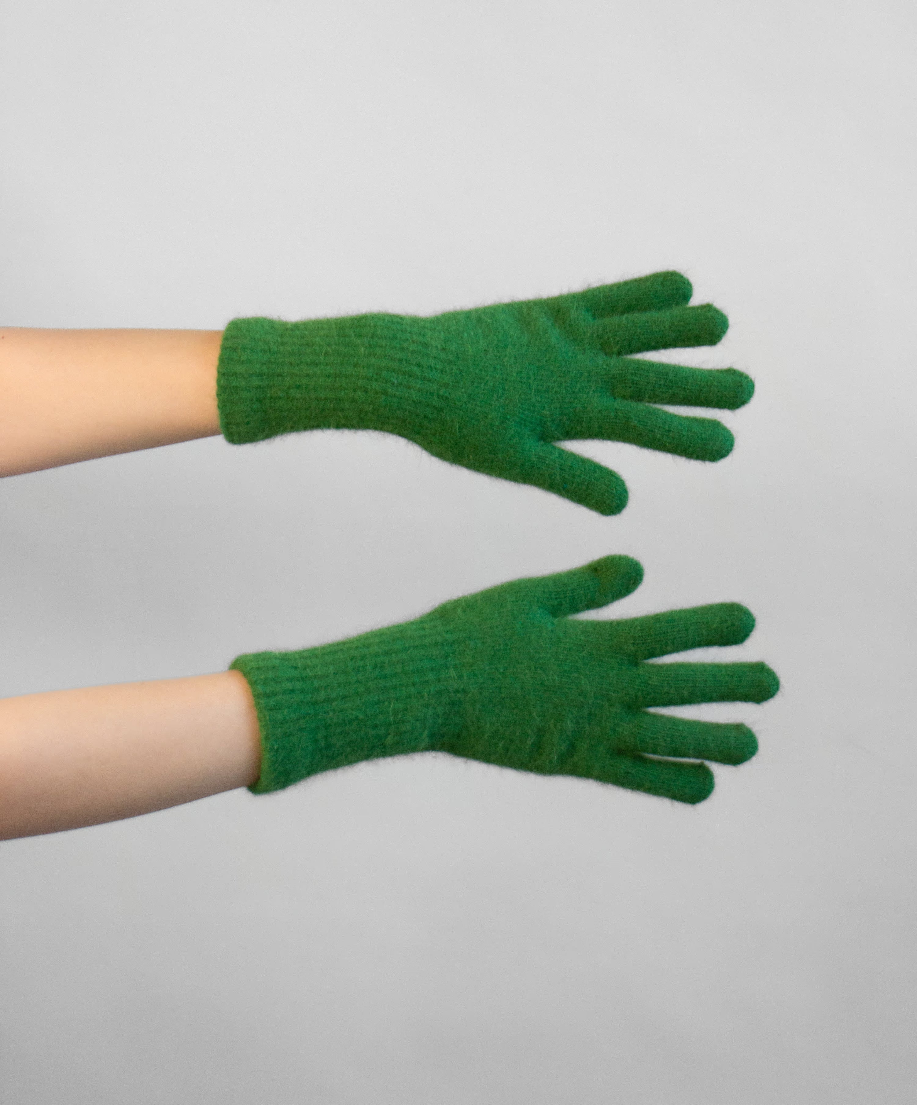 Close-up of angora knit fingerless gloves showing open fingertips