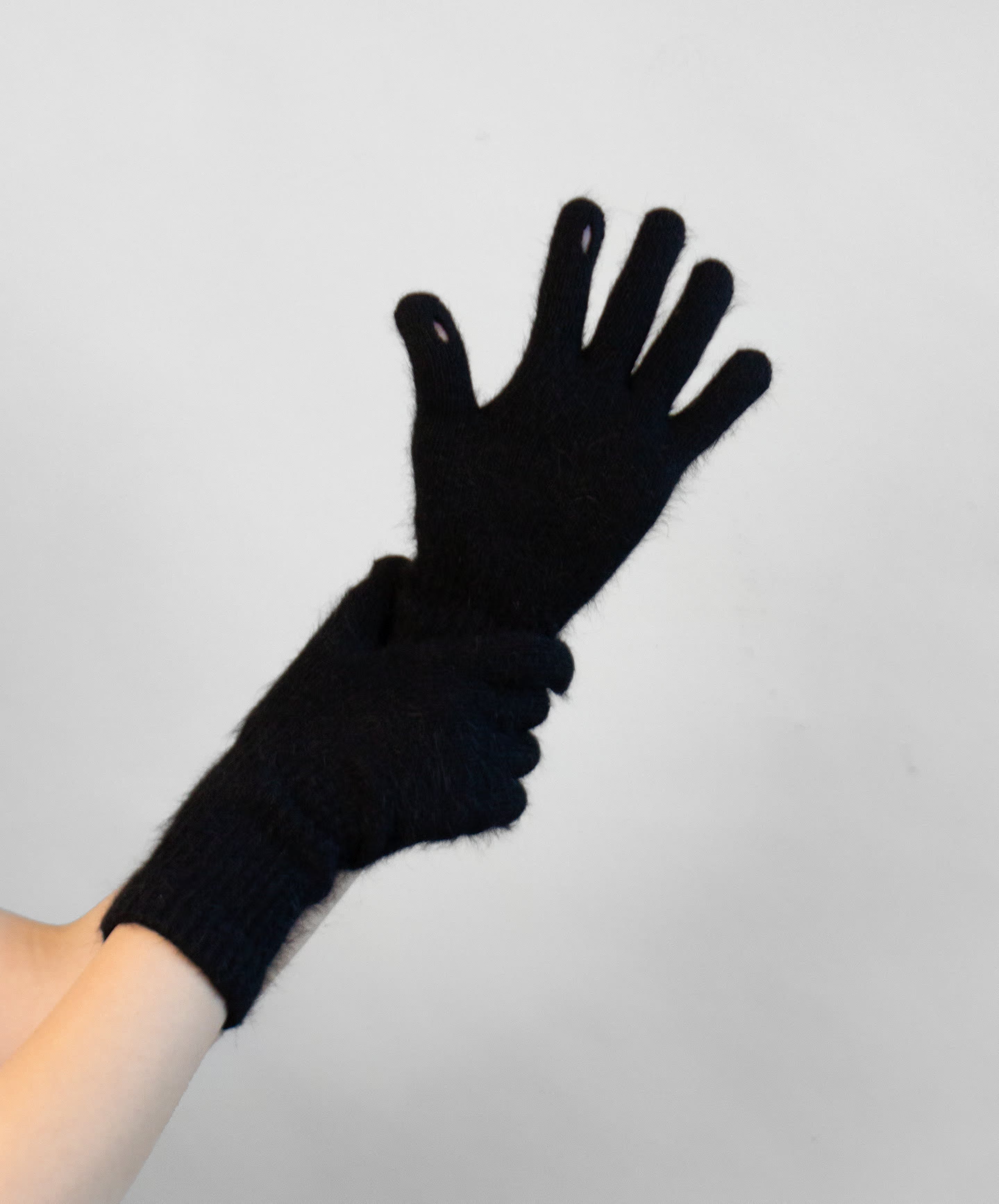 Close-up of angora knit fingerless gloves