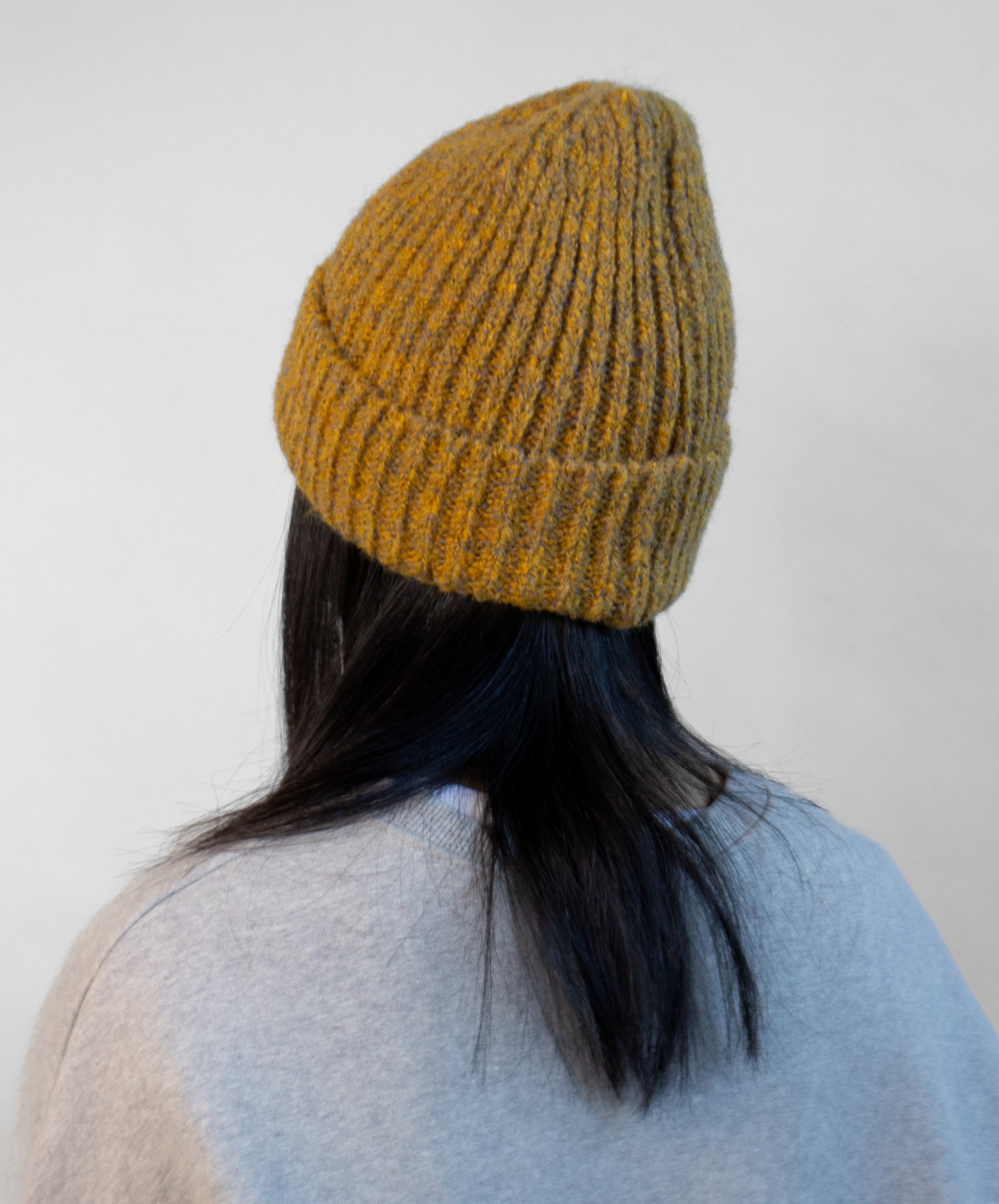 Side view of tweed yarn beanie