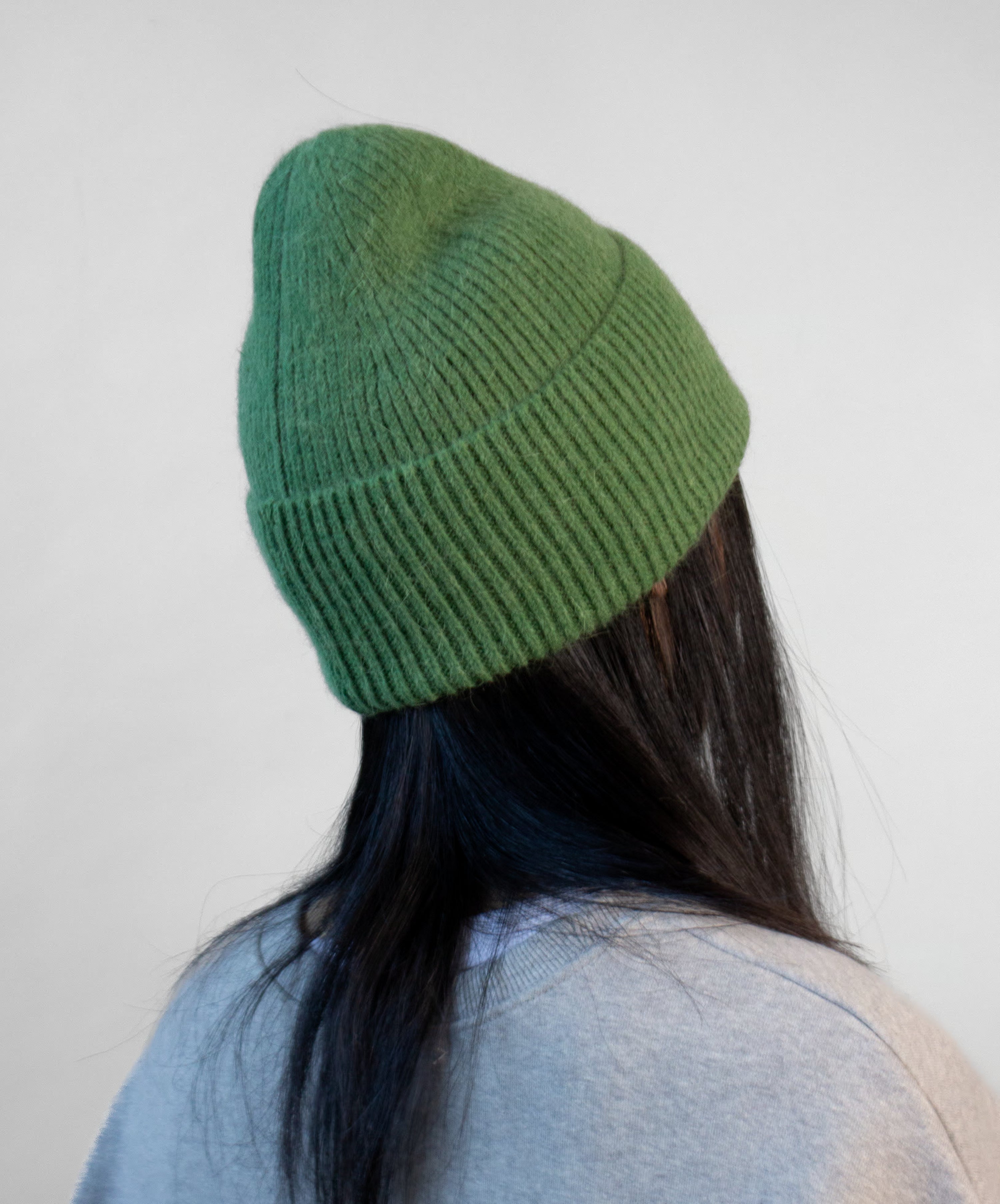 Side view of angora knit beanie showing textured knit pattern